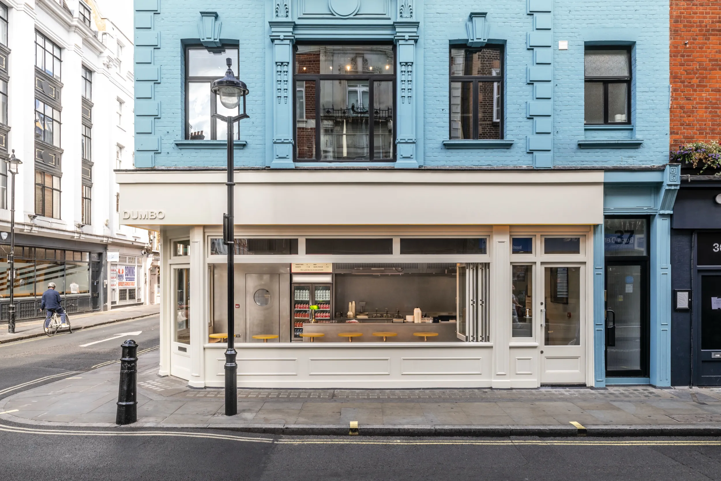 The Dumbo Soho storefront on Berwick Street, under a pale blue façade