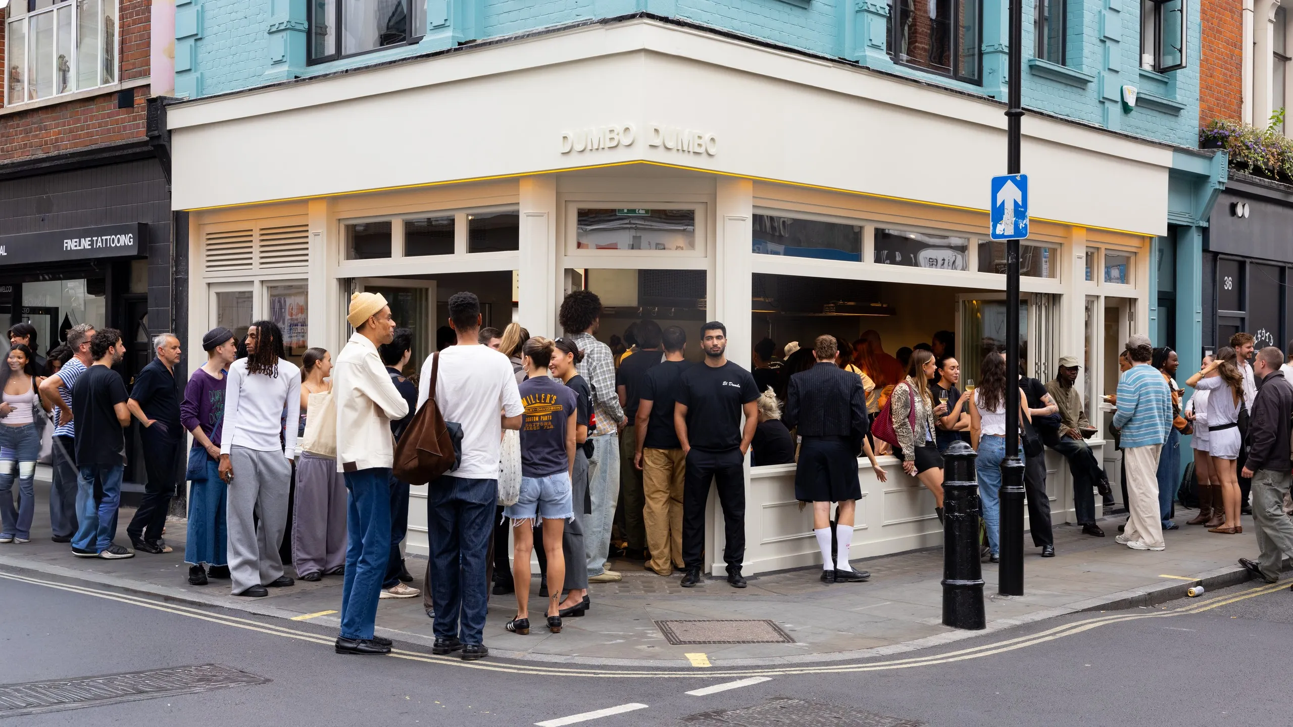 A queue along the corner of Berwick Street outside Dumbo Soho
